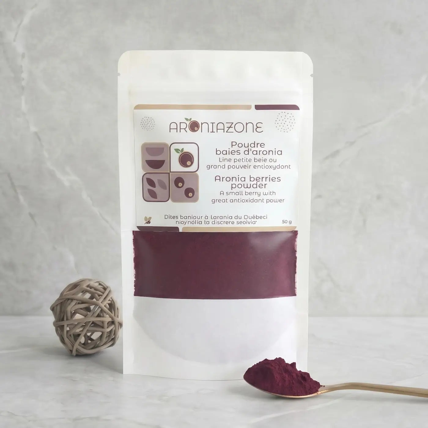 White resealable pouch of poudre daronia with clear window showing deep burgundy powder rich in fibres and antioxidants